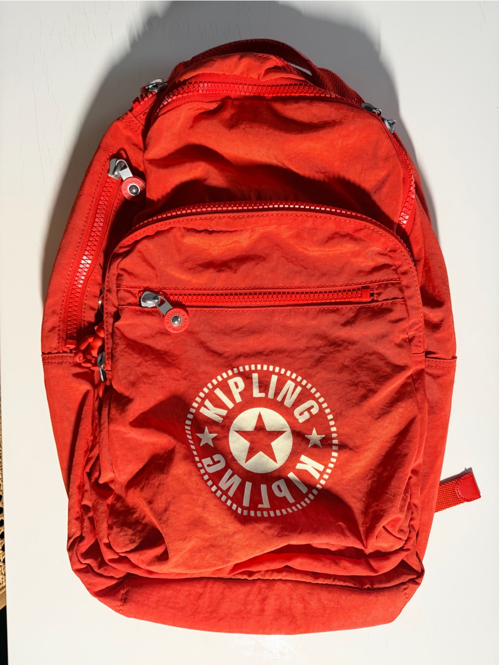 Kipling Seoul Backpack (in a red/orange nylon color)